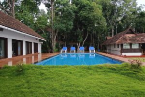 Best Ayurvedic Treatment and Panchakarma in Kerala | Shantitheeram Ayurveda Swimming Pool at Shantitheeram Ayurveda Resort Kerala