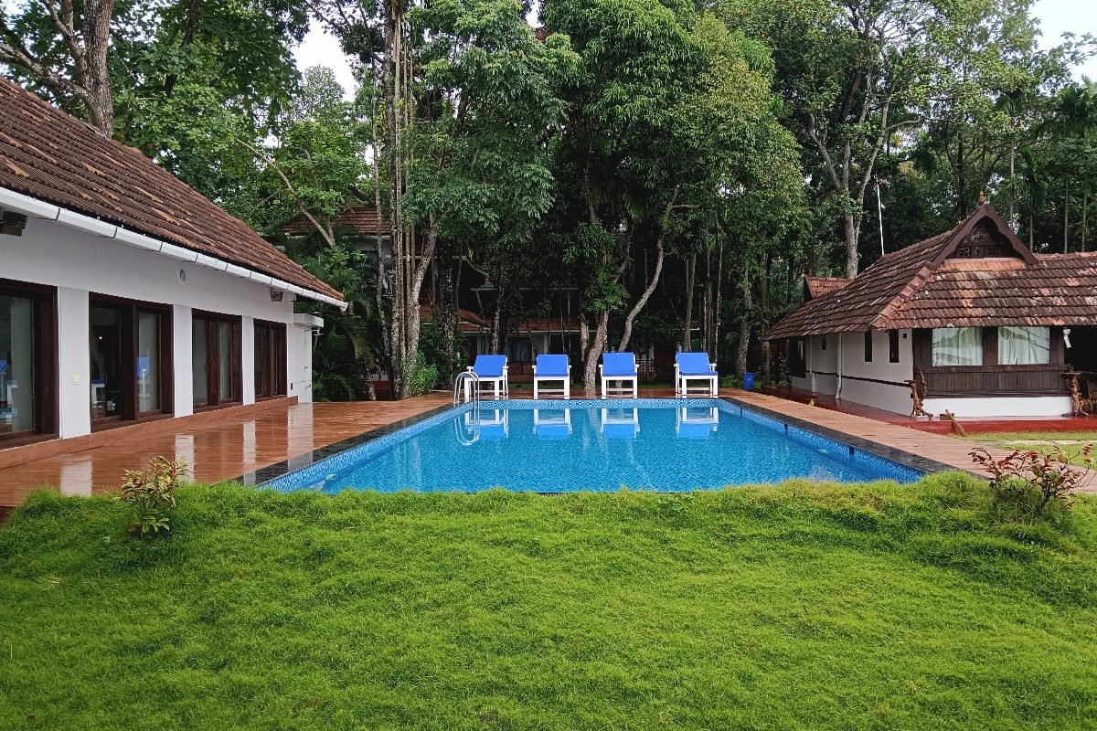 relaxing poolside shantitheeram alappuzha Swimming Pool at Shantitheeram Ayurveda Resort Kerala